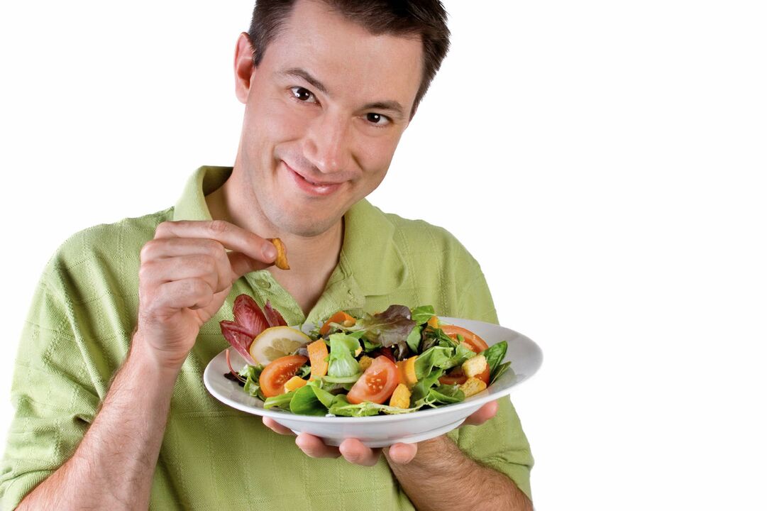 a man eats a vegetable salad for potency